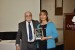 Dr. Nagib Callaos, General Chair, giving Prof. Fátima Consuelo Dolz a plaque "Por su Excelente Ponencia Plenaria."